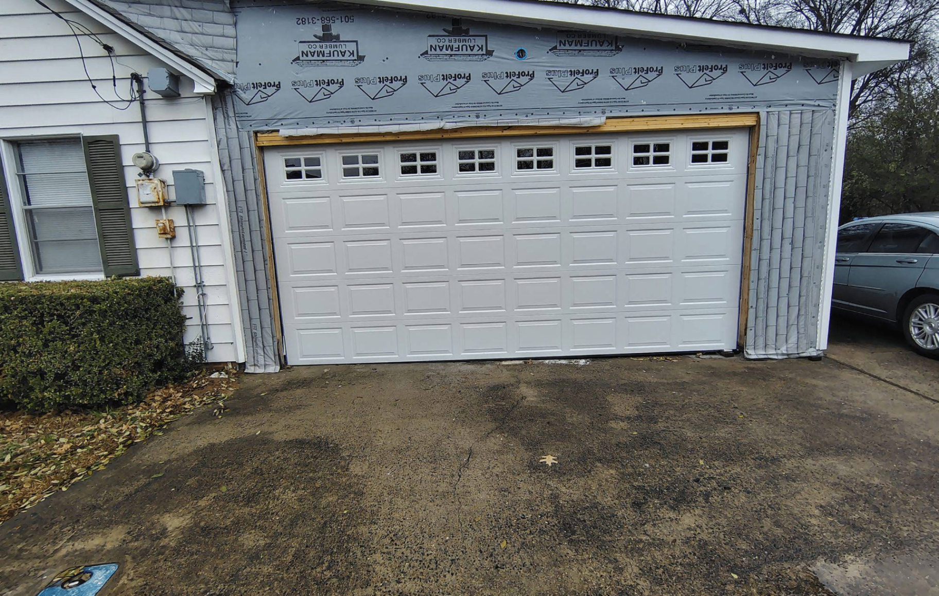 Residential home with a white garage door
