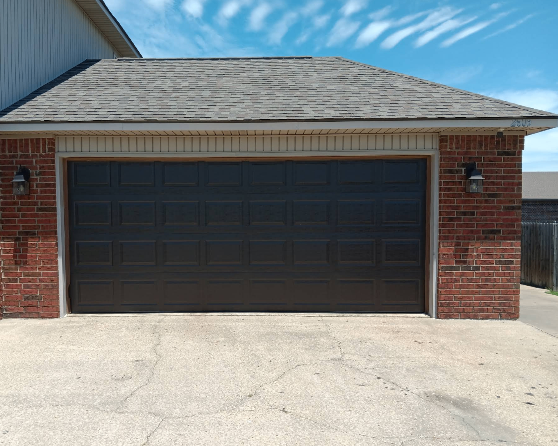 Residential home with a black garage door
